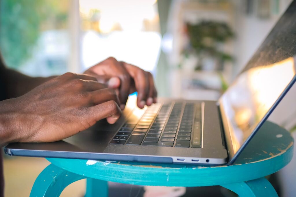 person using silver laptop computer